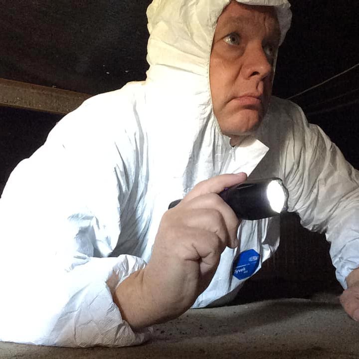 Home Inspector inspecting crawl space